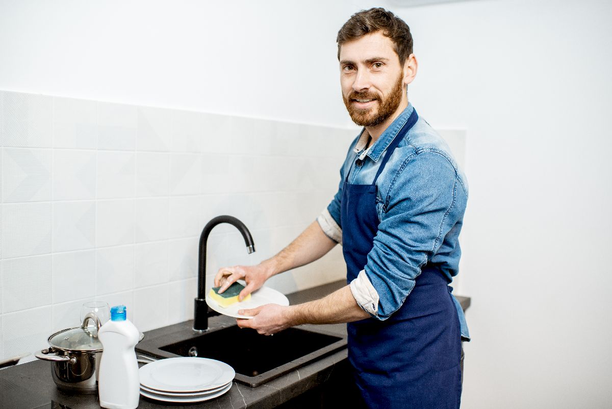 man washing dishes at home 2021 09 02 06 24 53 utc
